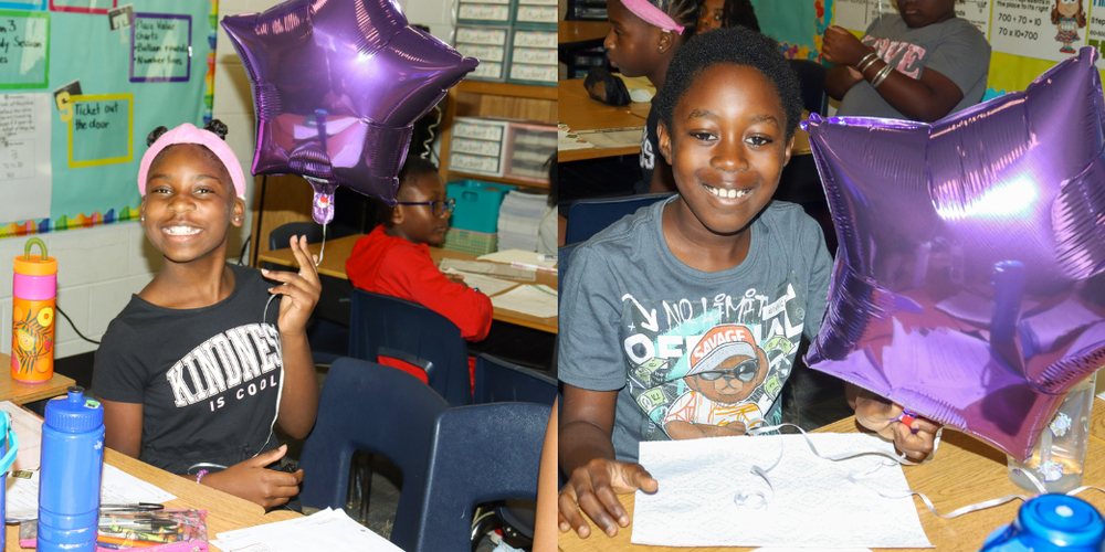 Arbor Station students with purple star balloons.