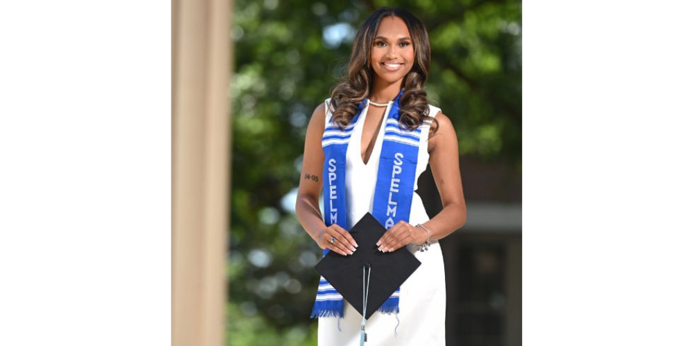 Photo of Tyler Dorsey holding graduation cap at Spelman.