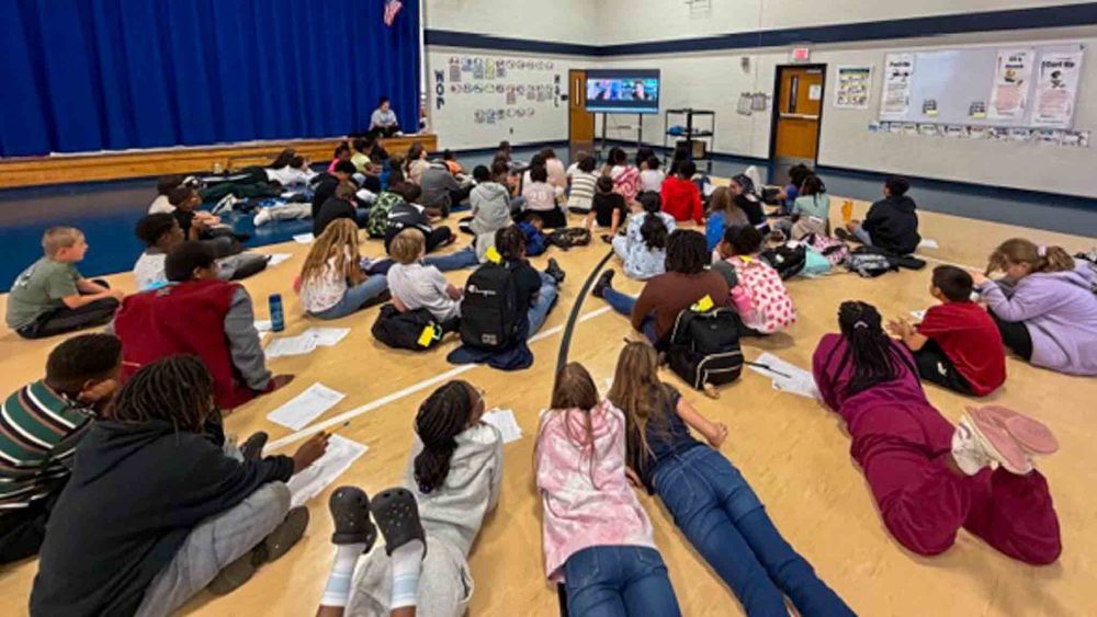 MAES students attend a virtual author visit.