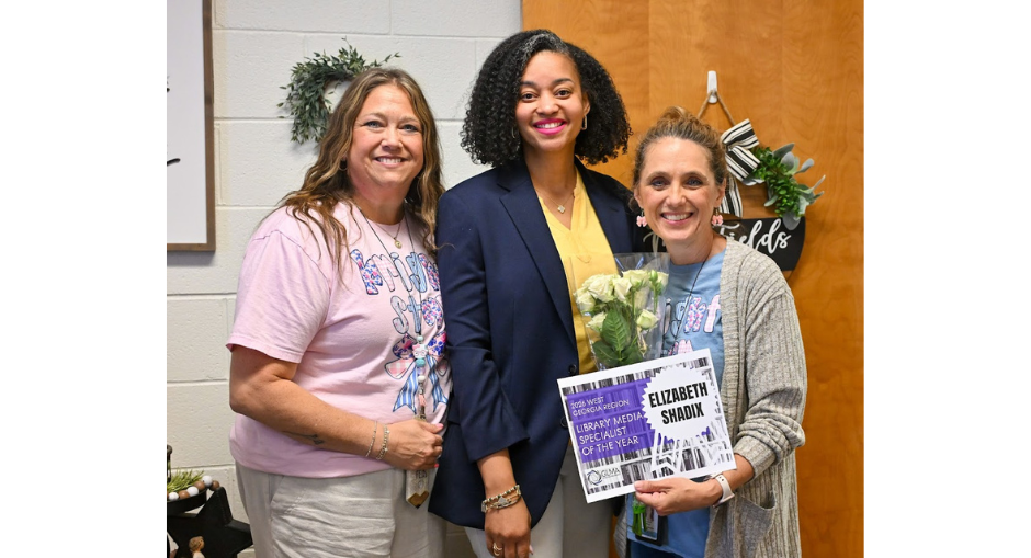 Bright Star Elementary Media Specialist Elizabeth Shadix shows off her certificate for winning West Georgia Region Media Specialist of the Year with Principal Heather Fields and Assistant Superintendent of Teaching and Learning Dr. K'Asha Davis.