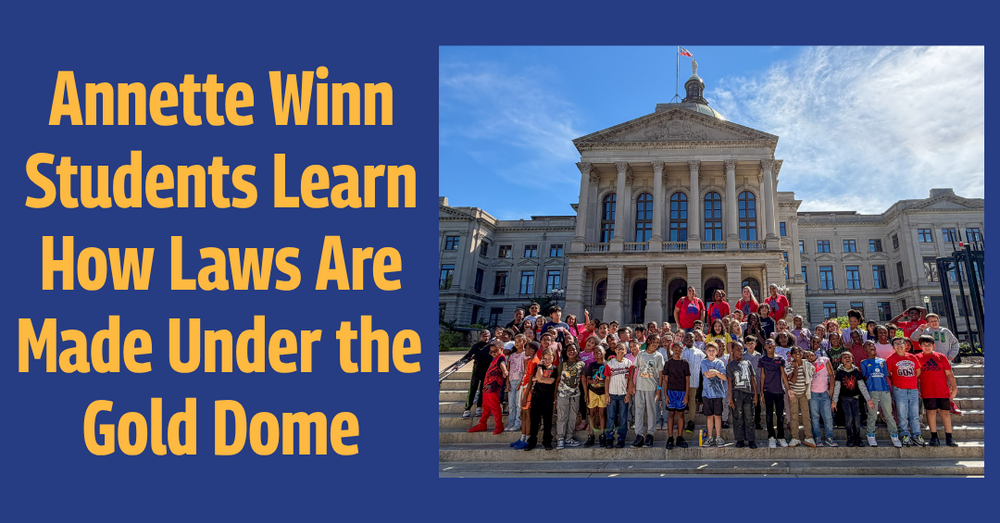 Dozens of Annette Winn Elementary students and chaperones pose on the steps of the Georgia State Capitol under a blue sky. Text reads: “Annette Winn Students Learn How Laws Are Made Under the Gold Dome.”