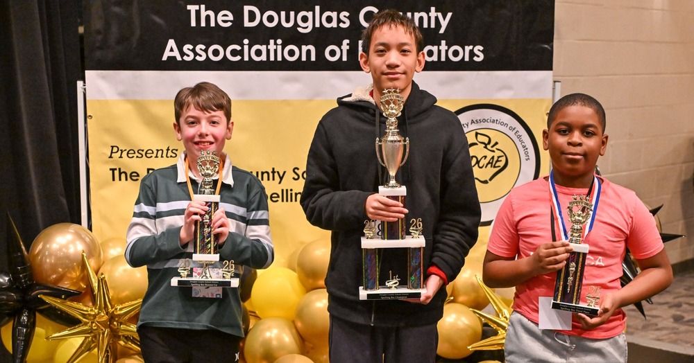 DCSS Spelling Bee finalists from left to right: Runner up Silas Ranne from Brighten Academy, winner William Liu from Chapel Hill Middle and third place finisher Ishmael Emeafor from Factoy Shoals Elementary.