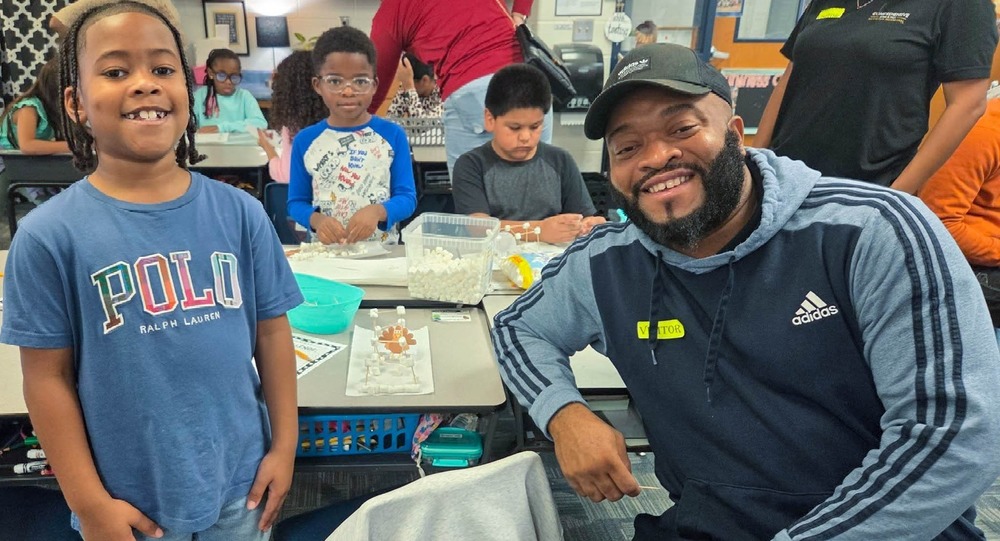 A MAES student and his father on National Parent Involvement Day