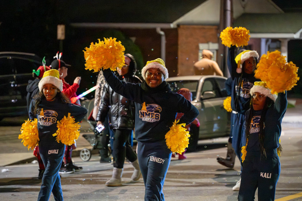 Cheerleaders from NMES cheer at the Jingle Jam parade.