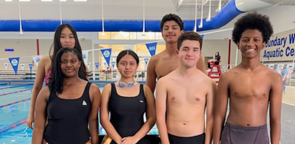 DCHS swim team members pose outside the pool.