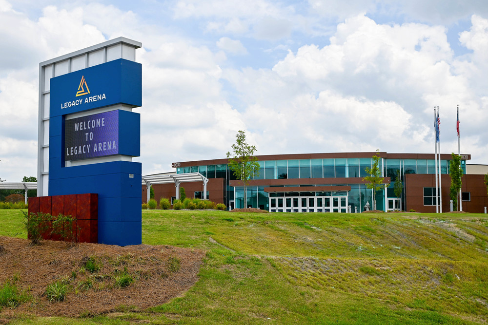 Photo of Legacy Arena exterior with sign.