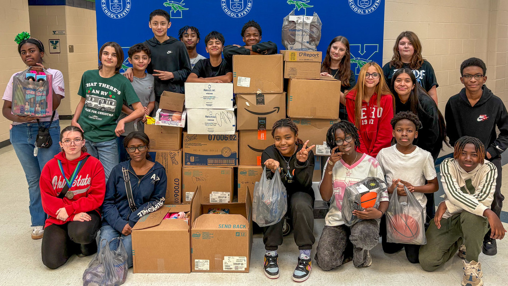 YMS students are pictured with donations.
