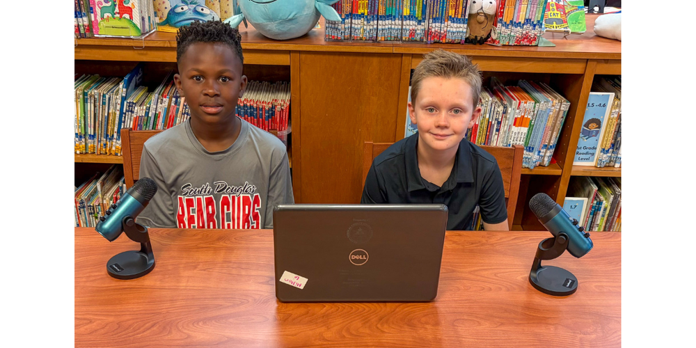South Douglas Elementary students Travis Bozeman and Oliver Heering work on their award-winning podcast.
