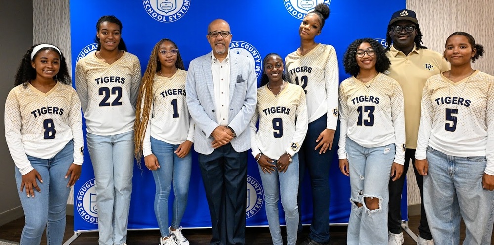 DCHS volleyball team with Dr. North
