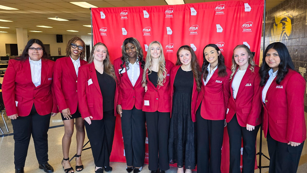 Eight Alexander High School FCCLA members who won top awards in the Region STAR Events Competition earlier this month are pictured in a group photo.