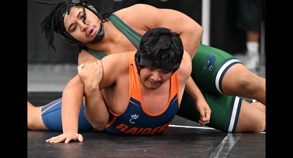 Two wrestlers in action during the GHSA Team Duals Wrestling Championship on Jan. 16, 2026.
