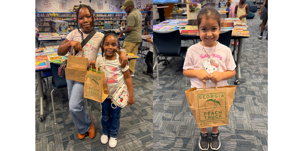 Bright Star Elementary students with their bags of free books from open house.