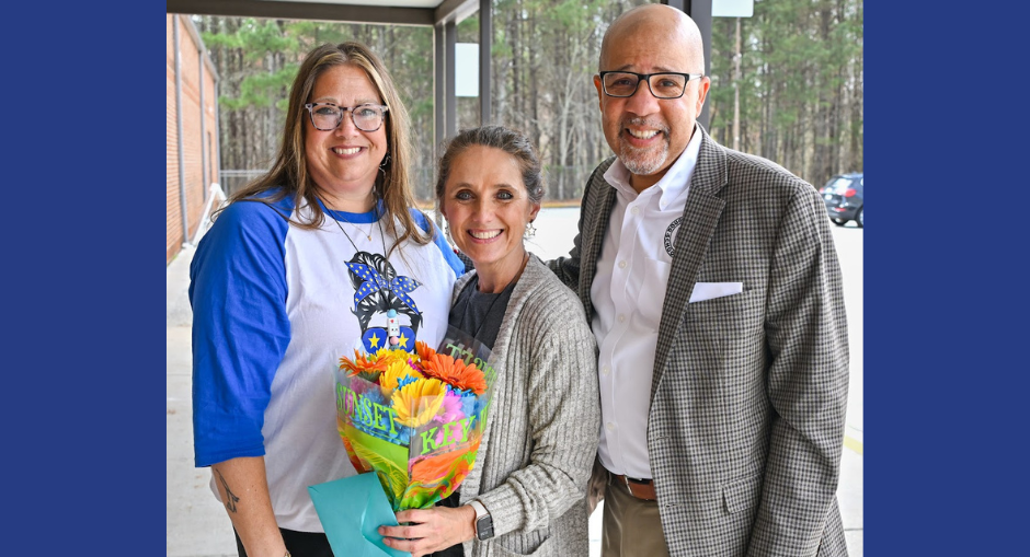 Bright Star Principal Heather Fields, Media Specialist of the Year Elizabeth Shadix and Superintendent Dr. Trent North take a group photo.