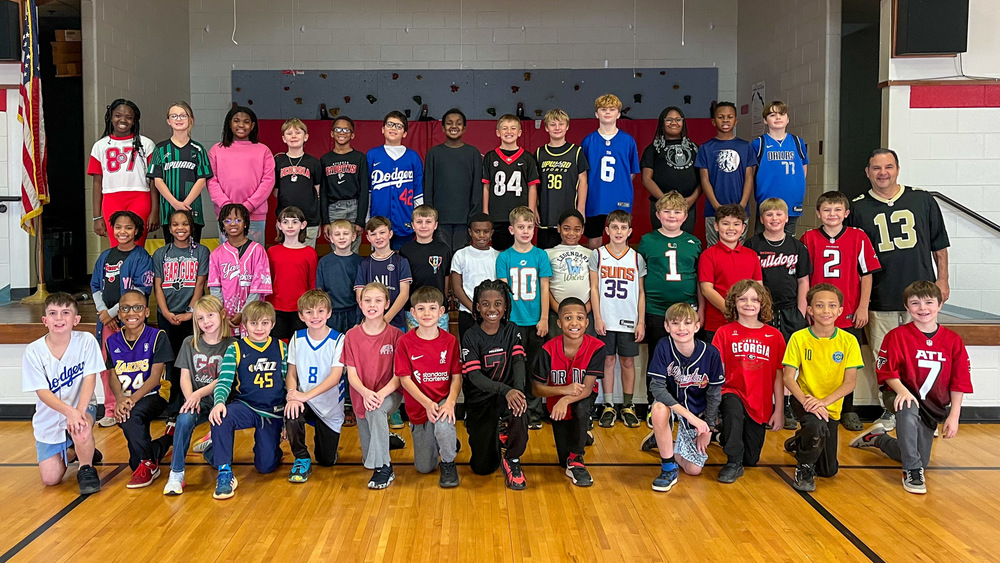 Group photo of students who participate in the South Douglas Reading and Sports Club.