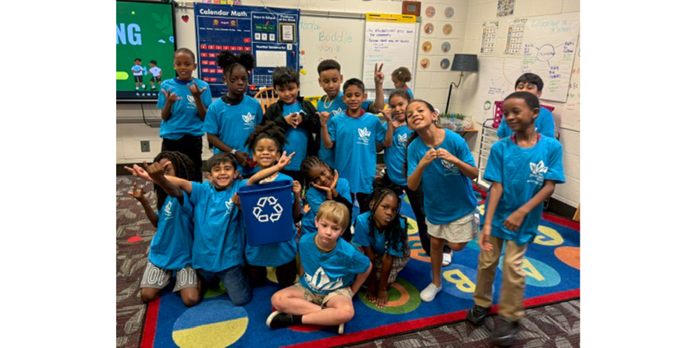 Eastside students with their recycling shirts and bin.