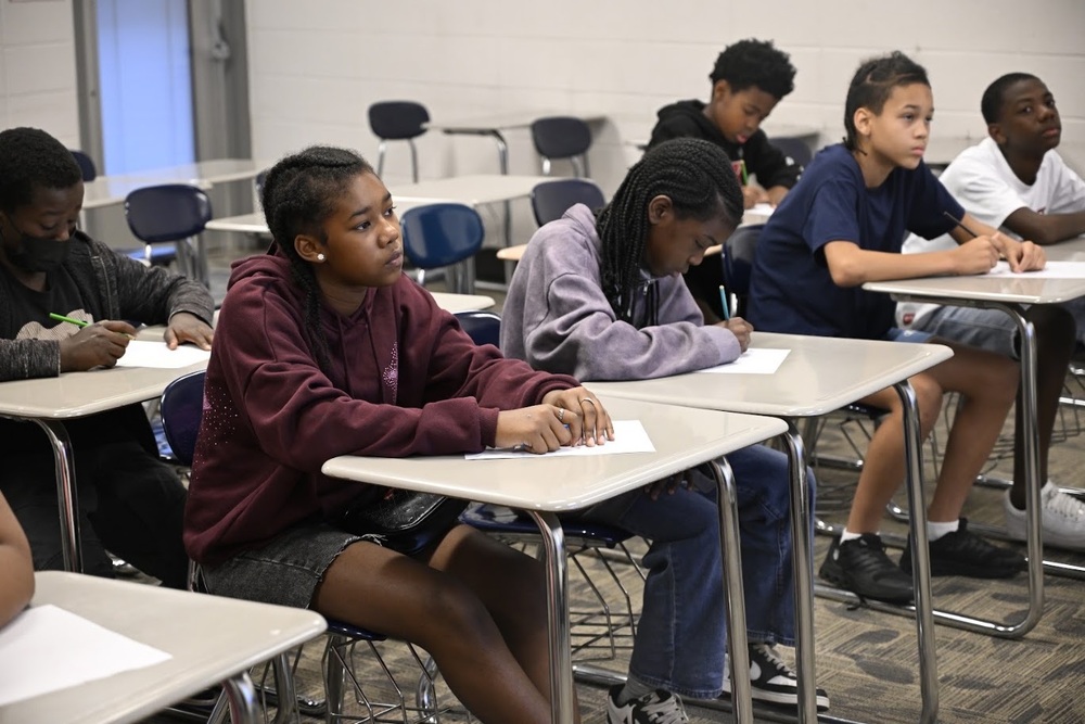 Students listen to a teacher during Middle School Transition Camp.