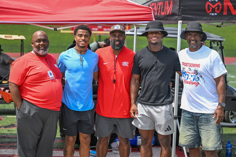 Group photo from the Trust Downs 7-on-7 Academy including New Manchester principal Casey Bethel, Josh Downs, Olten Downs, Caleb Downs and Gary Downs.