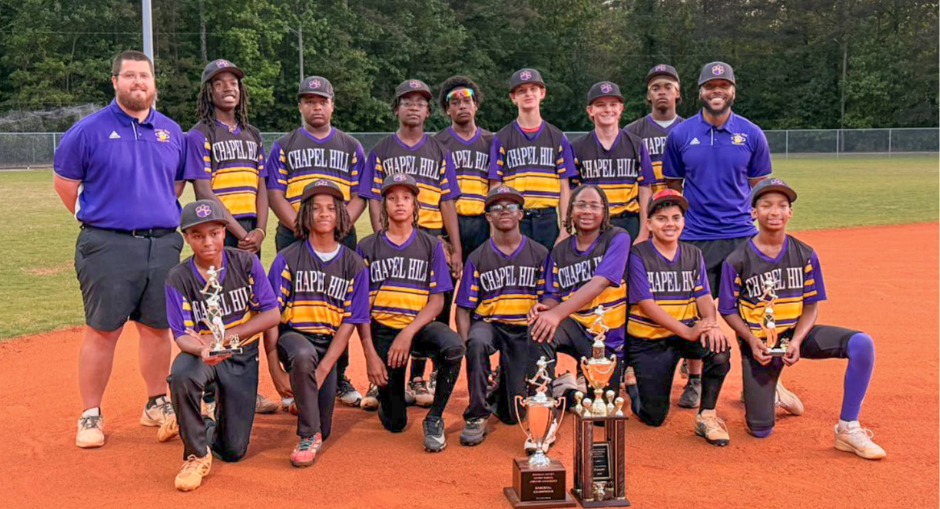 The Chapel Hill Middle baseball team poses with its championship trophy.