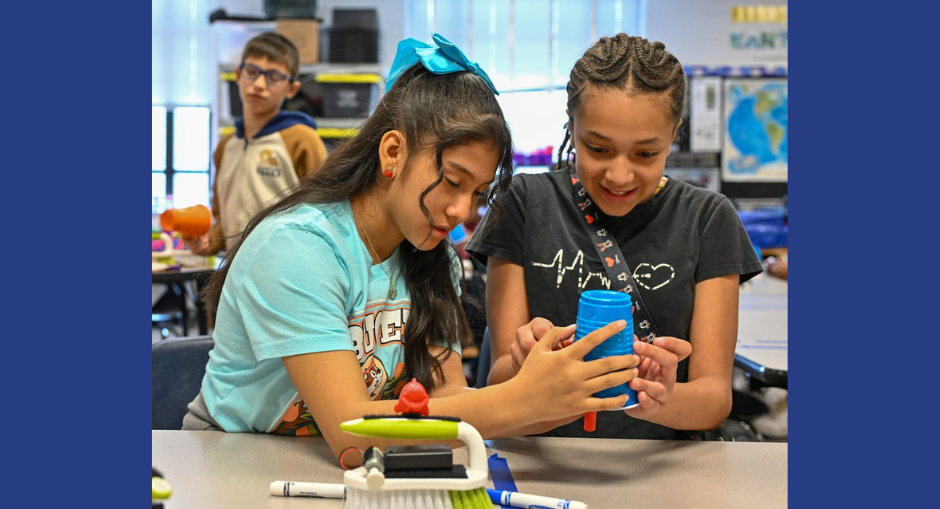 Bill Arp Elementary students work on a robotics project with plastic cups, a scrub brush, markers and other items during STEAM Day.