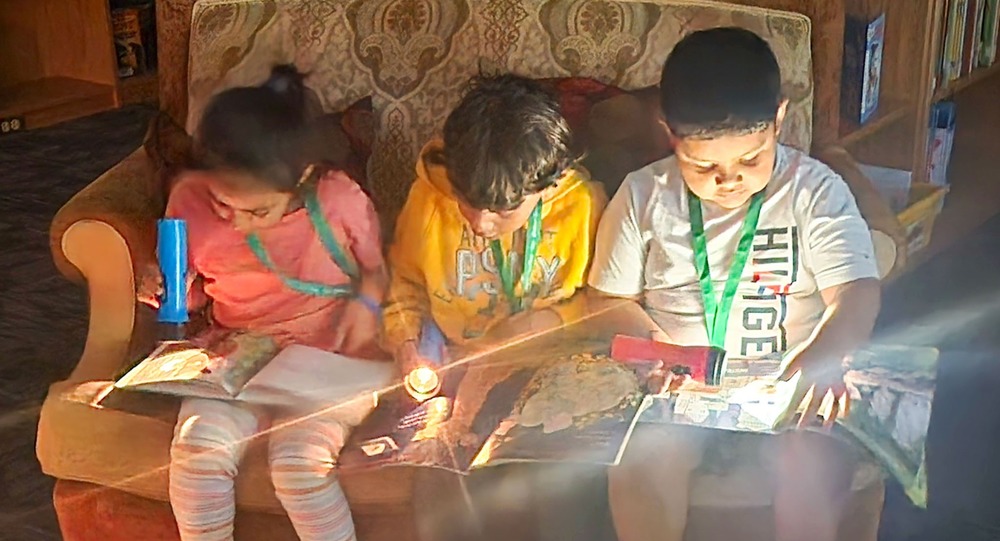 AWES students take part in Flashlight Friday.