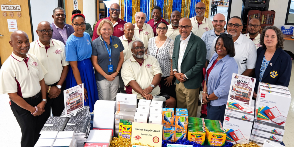 Group photo including Superintendent Dr. Trent North, DCHS Principal Michal Sims and representatives from the Community Diamonds Foundation, Inc. and the Carrollton-Douglasville Alumni Chapter of Kappa Alpha Psi Fraternity, Inc. at Douglas County High for the inaugural Teachers' Closet initiative. 