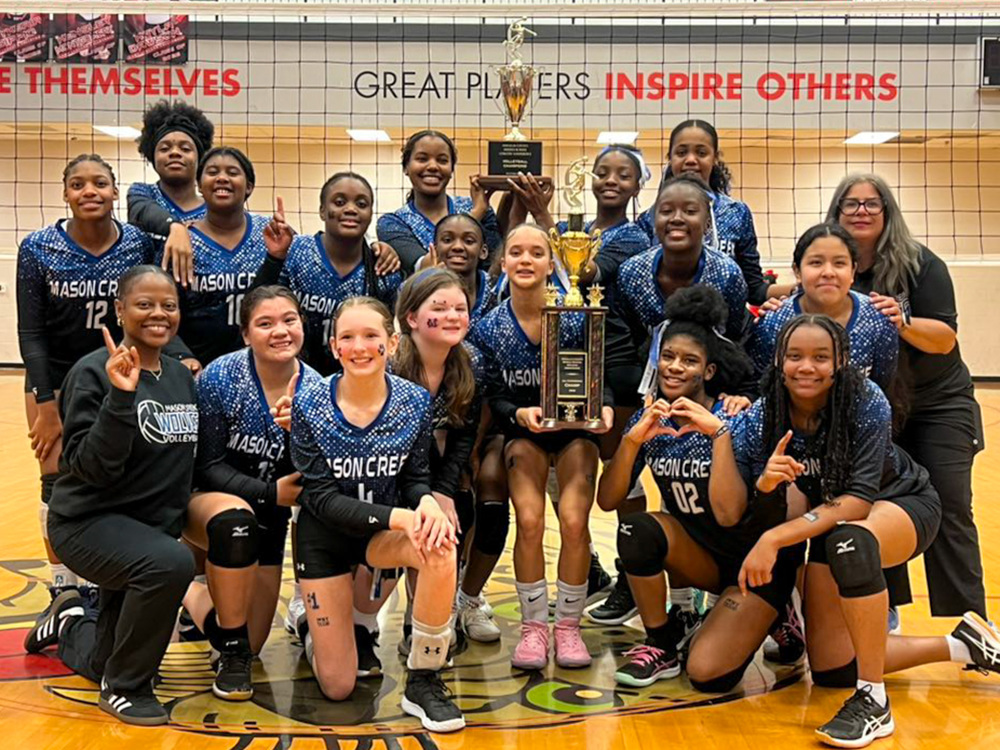 The Mason Creek Middle volleyball team is pictured with their championship trophy.
