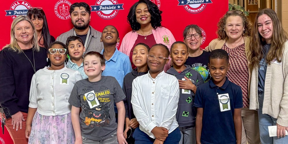 Bill Arp students, staff and administrators celebrate their state STEM challenge victory.