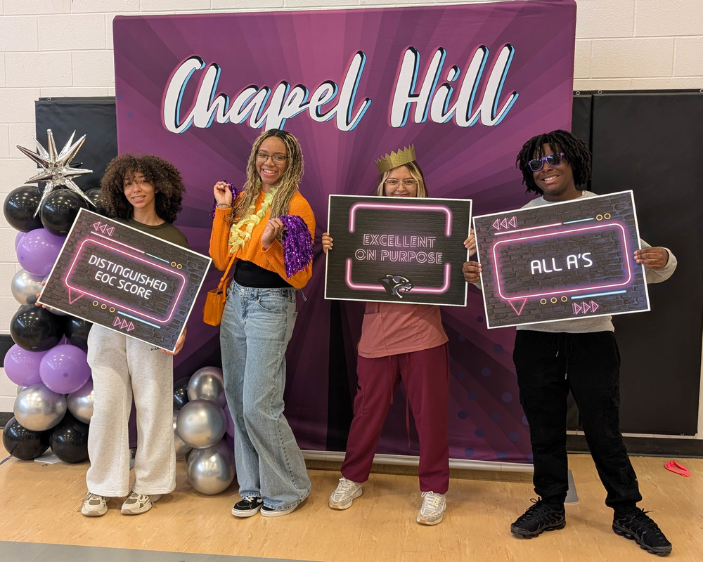 CHHS students holding up Excellence on Purpose signs