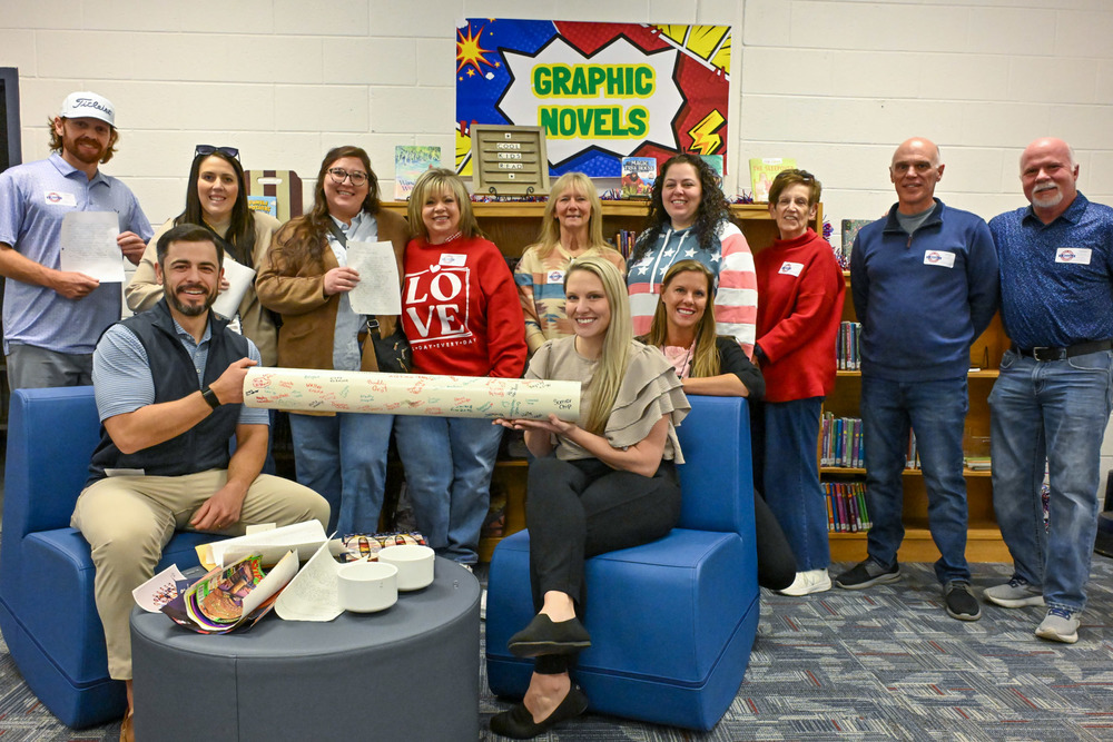 Former BAES students and teachers from the Class of 1999-2000 with their 26-year times capsule during a reunion at the school on Feb. 9, 2026.