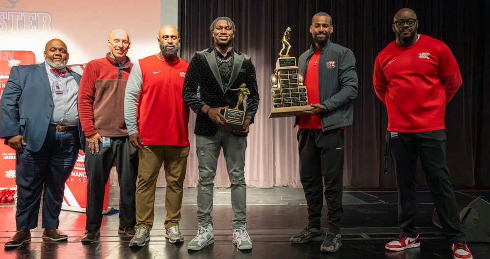 Delancy Alexander with the Howard Thompson trophy