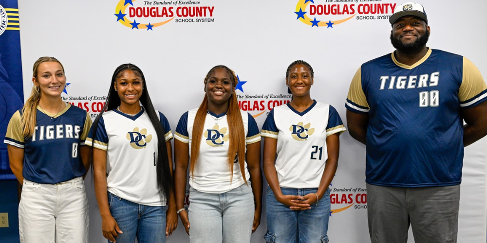 Group photo of the 2026 Douglas County High softball team coaches and players at Fall Media Day.