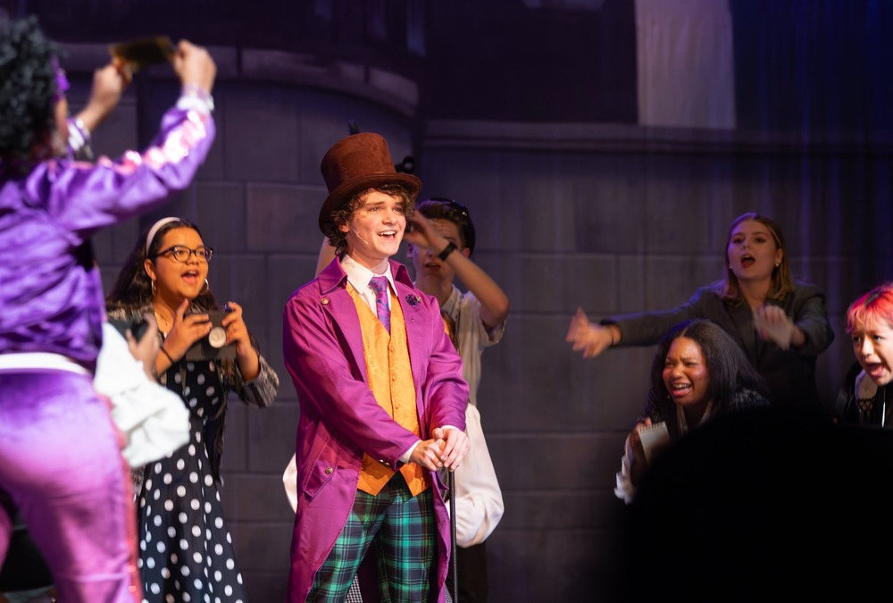 Philip Plumley performs as Willy Wonka in the Alexander High production of Charlie and the Chocolate Factory.