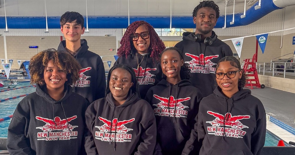 New Manchester swim team members and coach Kamaria Mahone.