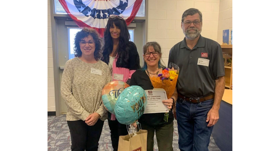 Bill Arp STEAM teacher Karen Gorzynski holds balloons and flowers are being surprised as the Douglas County Farm Bureau Ag in the Classroom Teacher of the Year. 