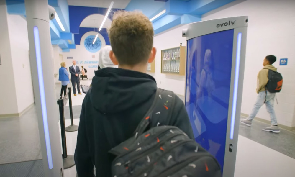 A rendering showing a student walks through an Evolv detection system.
