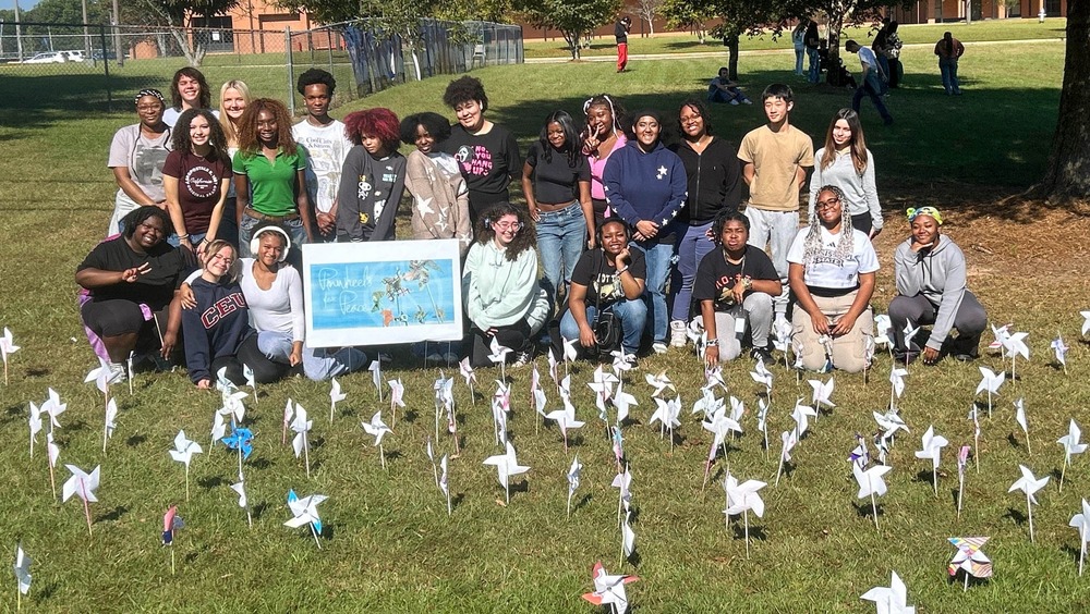 CHHS with their pinwheels for peace.