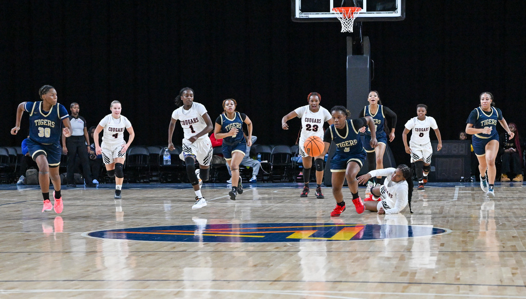 Alexander and Douglas County's girls play a basketball game in last year's tournament.