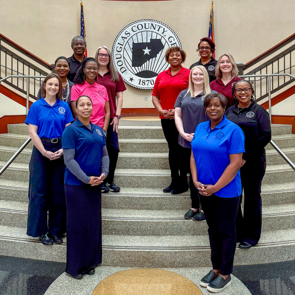 Group photo of DCSS social workers at the Douglas County Courthouse.