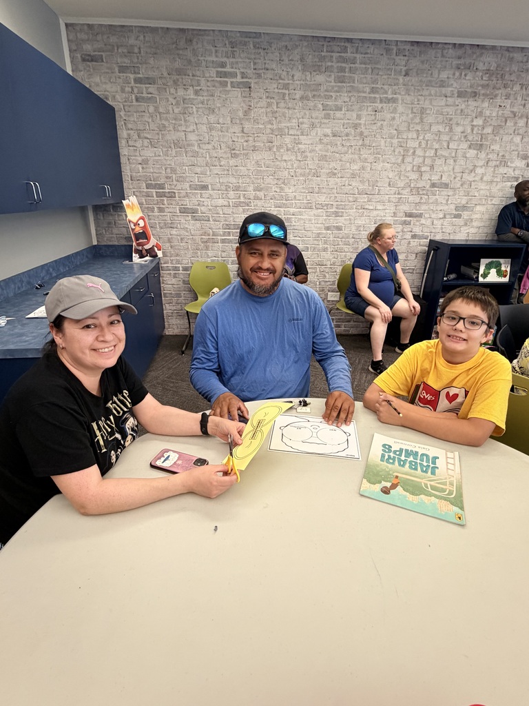 Santi and family working on literacy activity