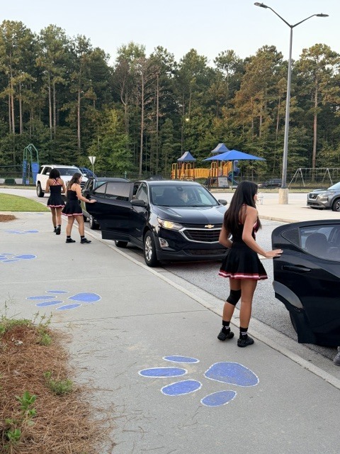 high school athletes help with car riders
