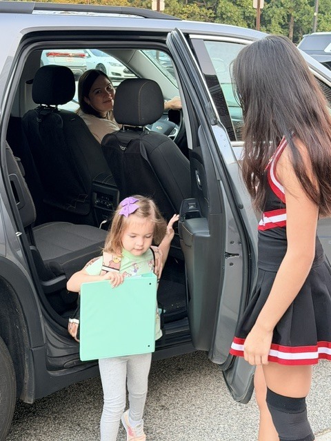 high school athletes help with car riders