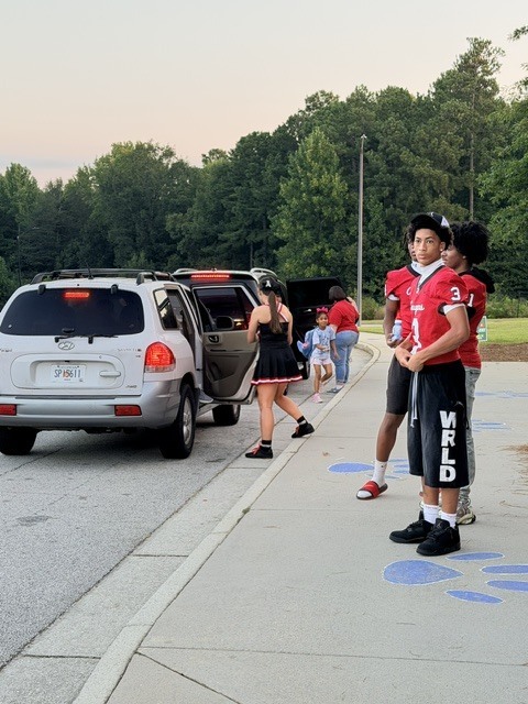 high school athletes help with car riders
