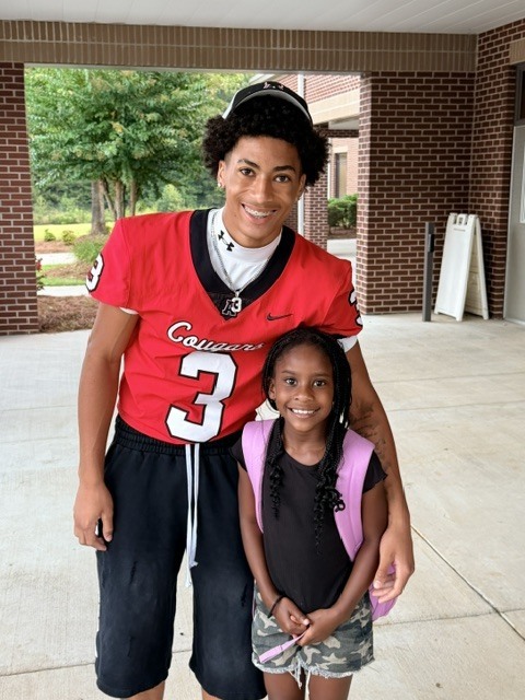 high school athletes help with car riders