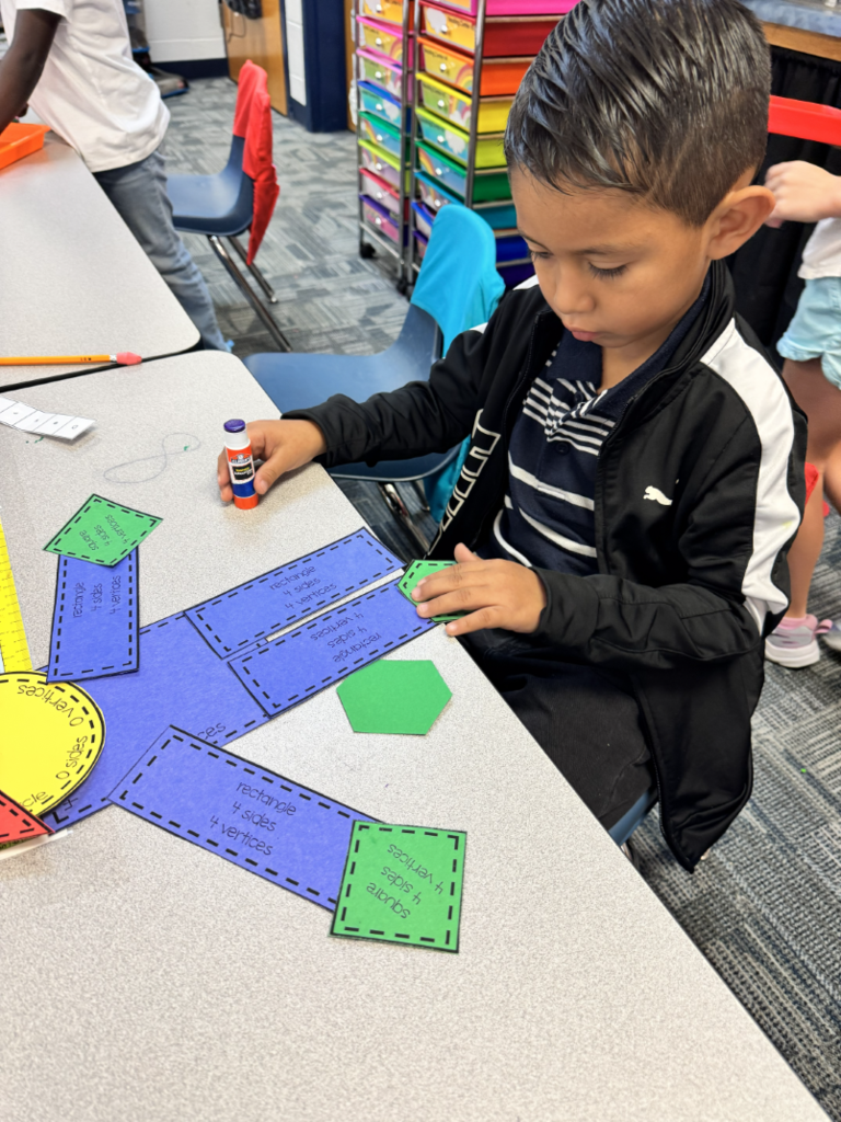 students building scarecrows with various shapes
