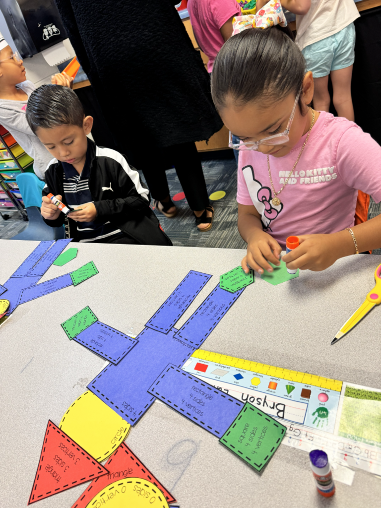 students building scarecrows with various shapes
