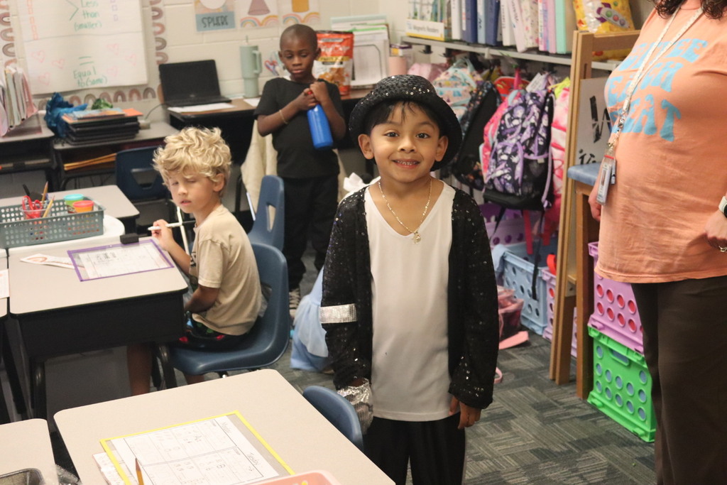 children and teachers dressed as glam or paparazzi