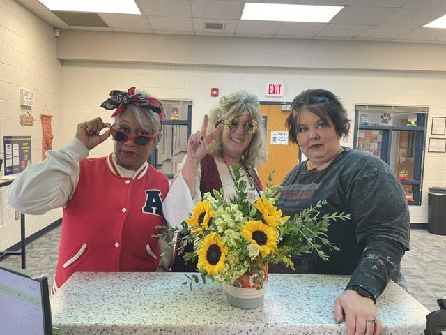 students and staff dressed up for decade day