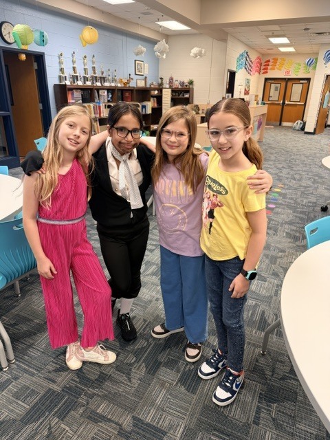 students and staff dressed up for decade day