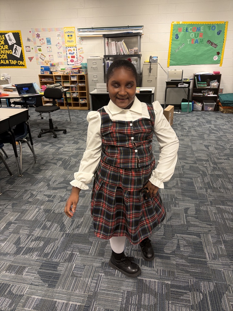 students and staff dressed up for decade day