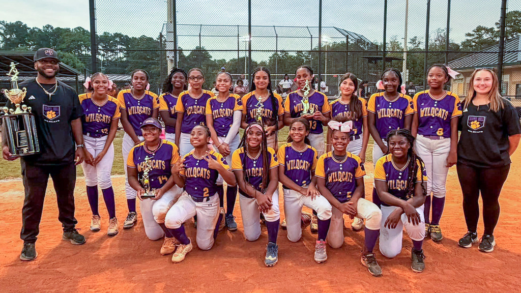 Chapel Hill Middle School softball team photo with coach holding trophy after winning the DCSS Middle School Championship.
